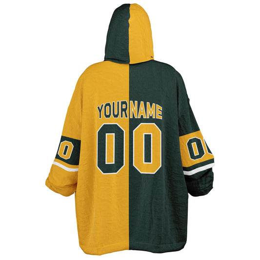 Green, gold, and white halftime snug hoodie with three-tone split design and cozy fleece texture.