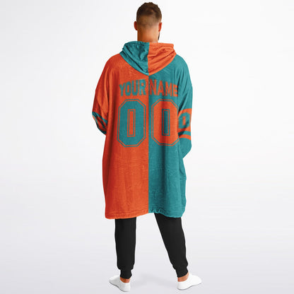 Aqua and orange halftime snug hoodie featuring a symmetrical split design for a dynamic game-day look.