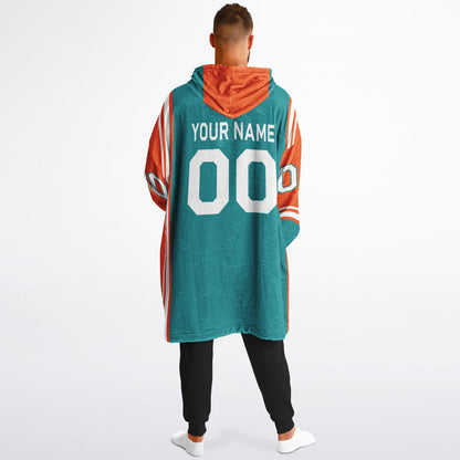 Aqua, orange, and white bold snug hoodie with triple color blocking and a sporty aesthetic.