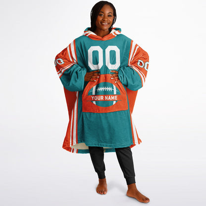 Aqua, orange, and white bold snug hoodie with triple color blocking and a sporty aesthetic.