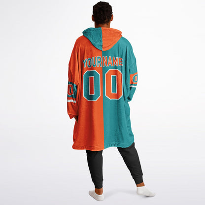 Aqua, orange and white halftime snug hoodie with three-tone split design and cozy fleece texture.