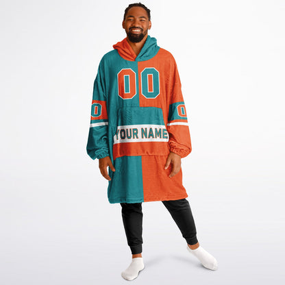 Aqua, orange and white halftime snug hoodie with three-tone split design and cozy fleece texture.