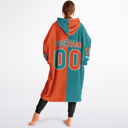 Aqua, orange and white halftime snug hoodie with three-tone split design and cozy fleece texture.
