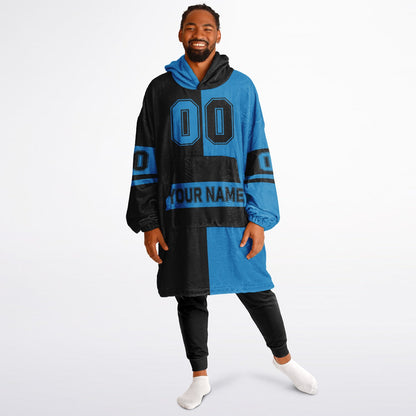 Black and blue halftime snug hoodie featuring a symmetrical split design for a dynamic game-day look.