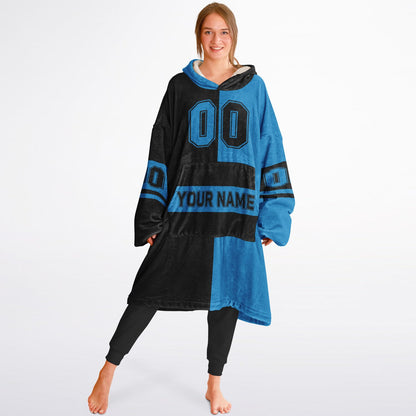 Black and blue halftime snug hoodie featuring a symmetrical split design for a dynamic game-day look.
