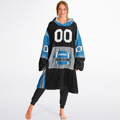 Black, blue, and silver bold snug hoodie with triple color blocking and a sporty aesthetic.