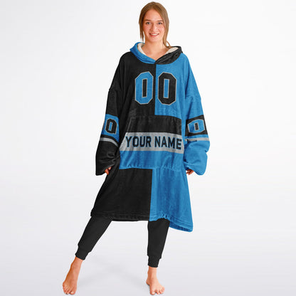 Black, blue, and silver halftime snug hoodie with three-tone split design and cozy fleece texture.