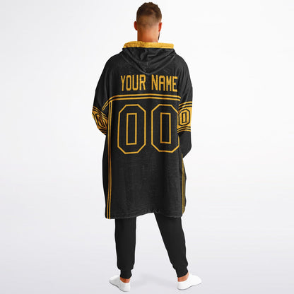 Black and gold lineup snug hoodie featuring sleek line-art details and minimalist team-inspired design.
