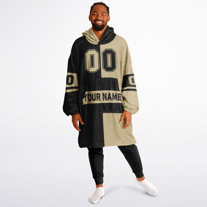 Black and old gold halftime snug hoodie featuring a symmetrical split design for a dynamic game-day look.