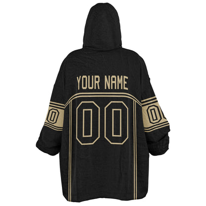 Black and old gold lineup snug hoodie featuring sleek line-art details and minimalist team-inspired design.
