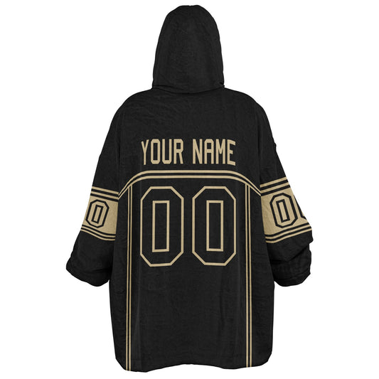 Black and old gold lineup snug hoodie featuring sleek line-art details and minimalist team-inspired design.