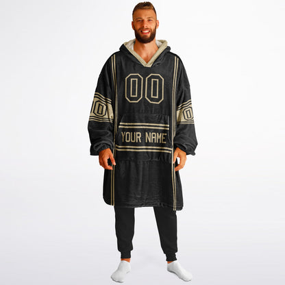 Black and old gold lineup snug hoodie featuring sleek line-art details and minimalist team-inspired design.