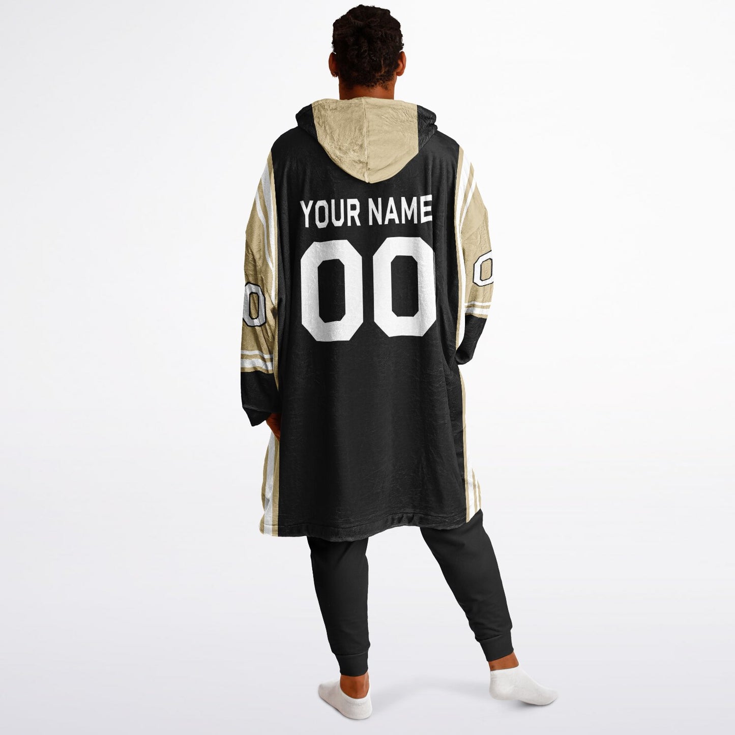 Black, old gold, and white bold snug hoodie with triple color blocking and a sporty aesthetic.