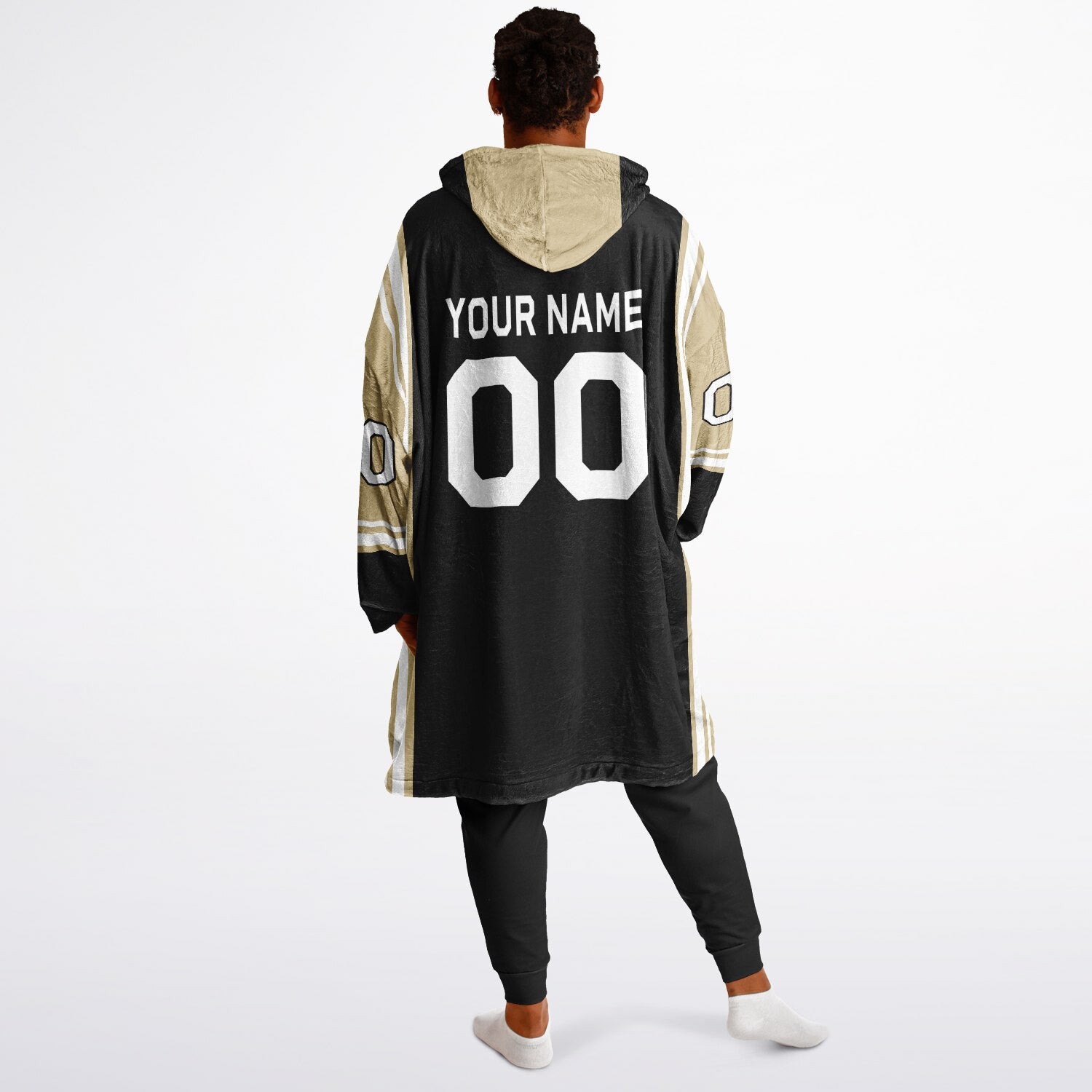 Black, old gold, and white bold snug hoodie with triple color blocking and a sporty aesthetic.