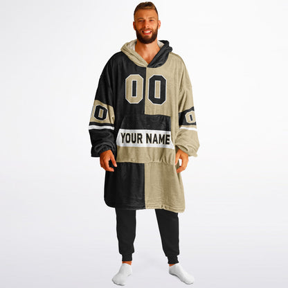 Black, old gold, and white halftime snug hoodie with three-tone split design and cozy fleece texture.