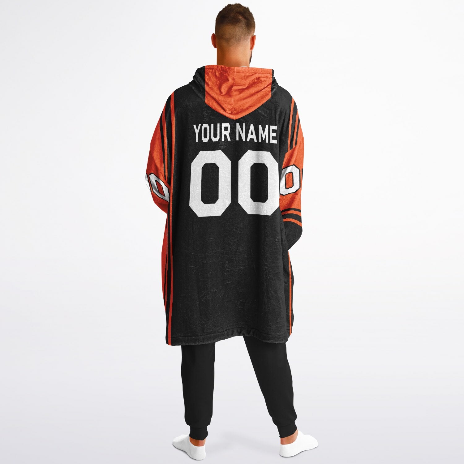 Black and orange bold snug hoodie with modern color-block design and soft loungewear fit.
