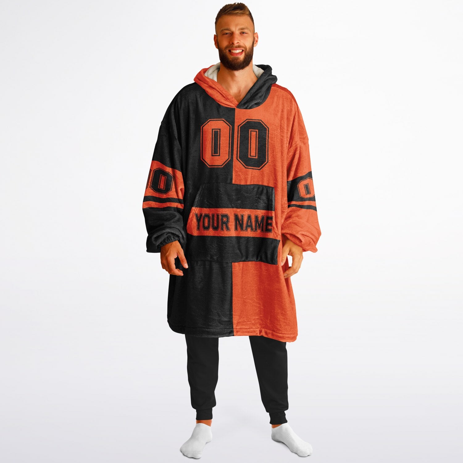Black and orange halftime snug hoodie featuring a symmetrical split design for a dynamic game-day look.