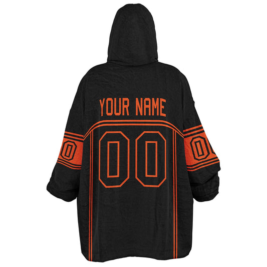 Black and orange lineup snug hoodie featuring sleek line-art details and minimalist team-inspired design.
