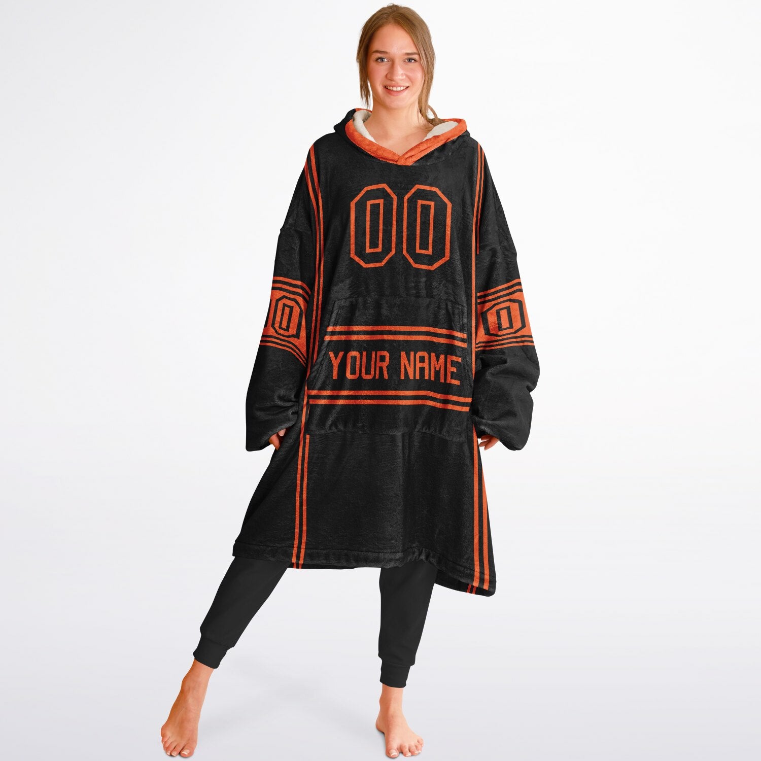 Black and orange lineup snug hoodie featuring sleek line-art details and minimalist team-inspired design.