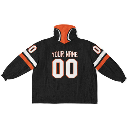 Black, orange, and white classic snug hoodie featuring authentic jersey striping and personalized number details.