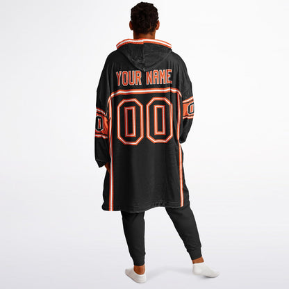 Black, orange, and white lineup snug hoodie with clean line work and subtle jersey influence.