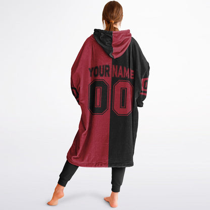 Black and red halftime snug hoodie featuring a symmetrical split design for a dynamic game-day look.
