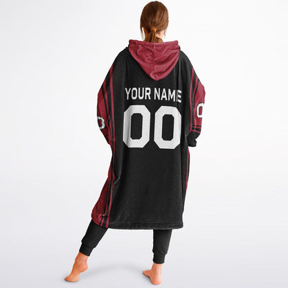 Black and red bold snug hoodie with modern color-block design and soft loungewear fit.