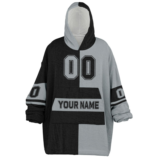 Black and silver halftime snug hoodie featuring a symmetrical split design for a dynamic game-day look.