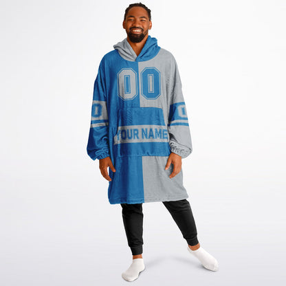 Blue and silver halftime snug hoodie featuring a symmetrical split design for a dynamic game-day look.