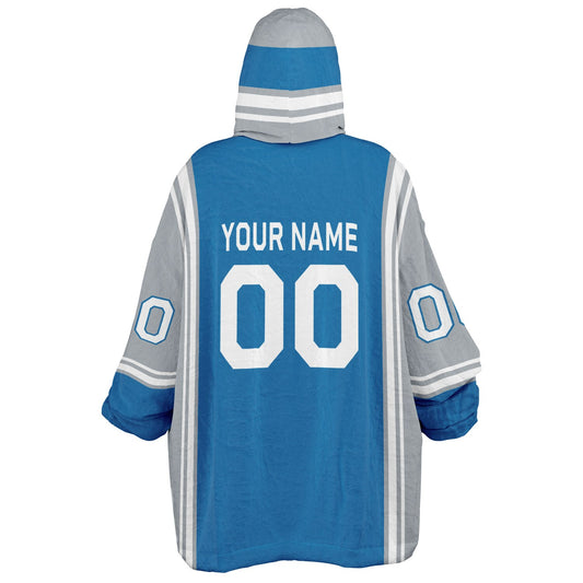 Blue, silver, and white bold snug hoodie with triple color blocking and a sporty aesthetic.