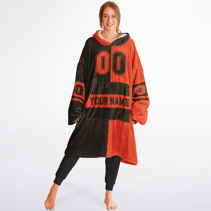 Brown and orange halftime snug hoodie featuring a symmetrical split design for a dynamic game-day look.