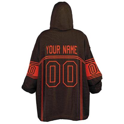 Brown and orange lineup snug hoodie featuring sleek line-art details and minimalist team-inspired design.