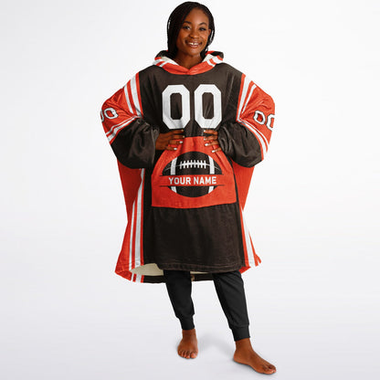 Brown, orange, and white bold snug hoodie with triple color blocking and a sporty aesthetic.