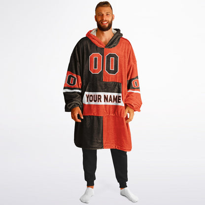 Brown, orange, and white halftime snug hoodie with three-tone split design and cozy fleece texture.