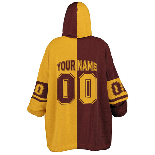 Burgundy and gold halftime snug hoodie featuring a symmetrical split design for a dynamic game-day look.