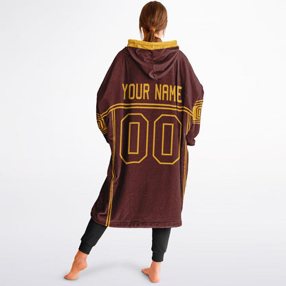Burgundy and gold lineup snug hoodie featuring sleek line-art details and minimalist team-inspired design.