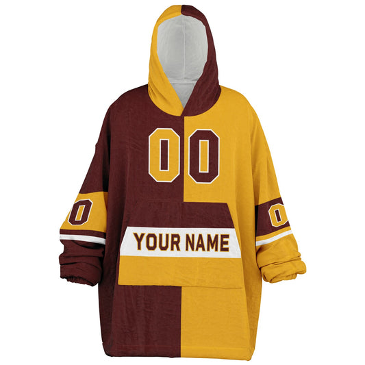 Burgundy, gold, and white halftime snug hoodie with three-tone split design and cozy fleece texture.