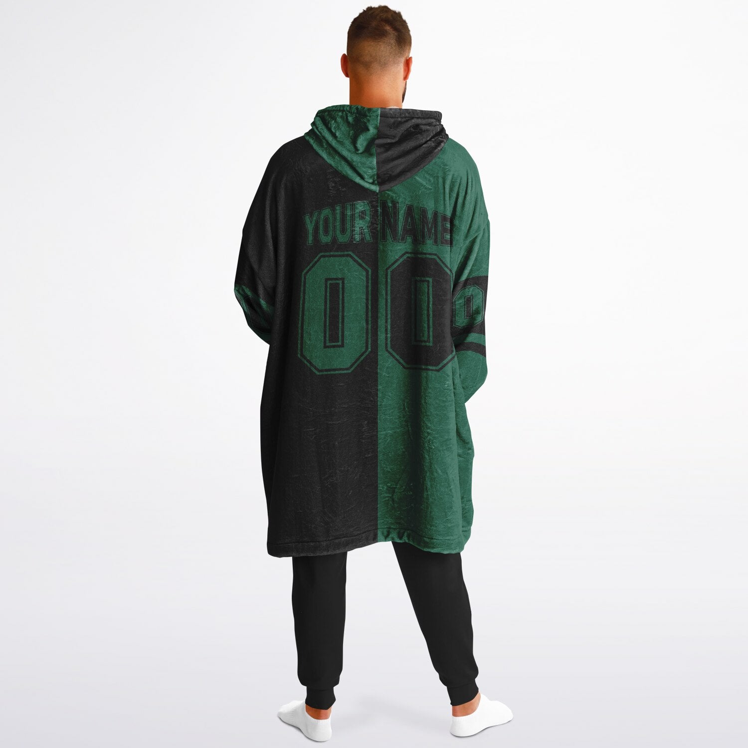 Green and black halftime snug hoodie featuring a symmetrical split design for a dynamic game-day look.