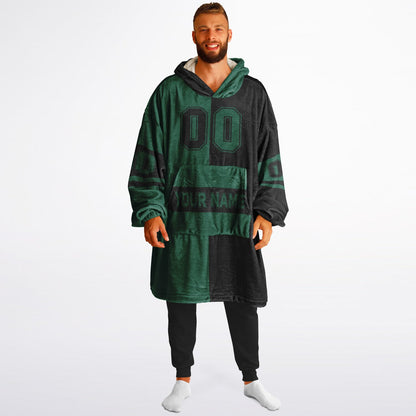 Green and black halftime snug hoodie featuring a symmetrical split design for a dynamic game-day look.