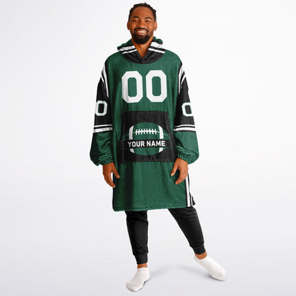 Green, black, and white bold snug hoodie with triple color blocking and a sporty aesthetic.