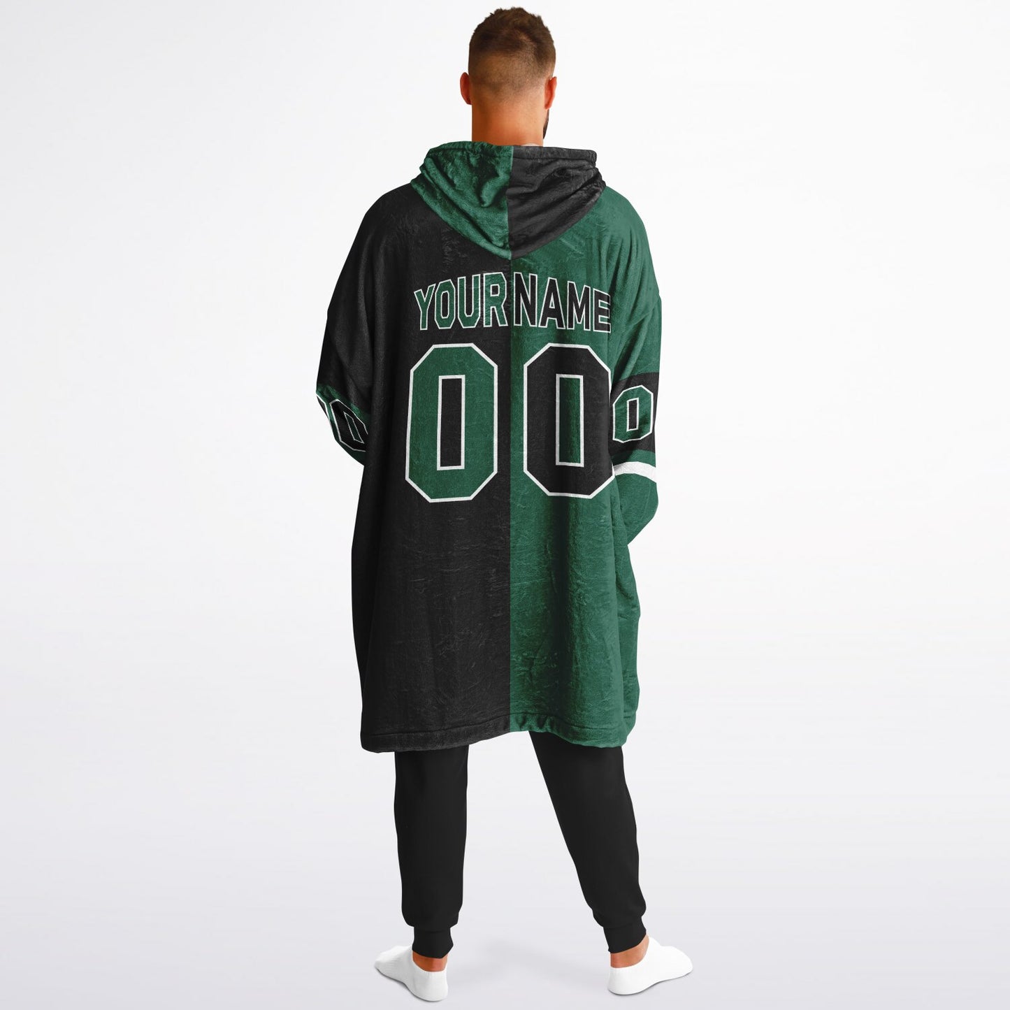 Green, black, and white halftime snug hoodie with three-tone split design and cozy fleece texture.