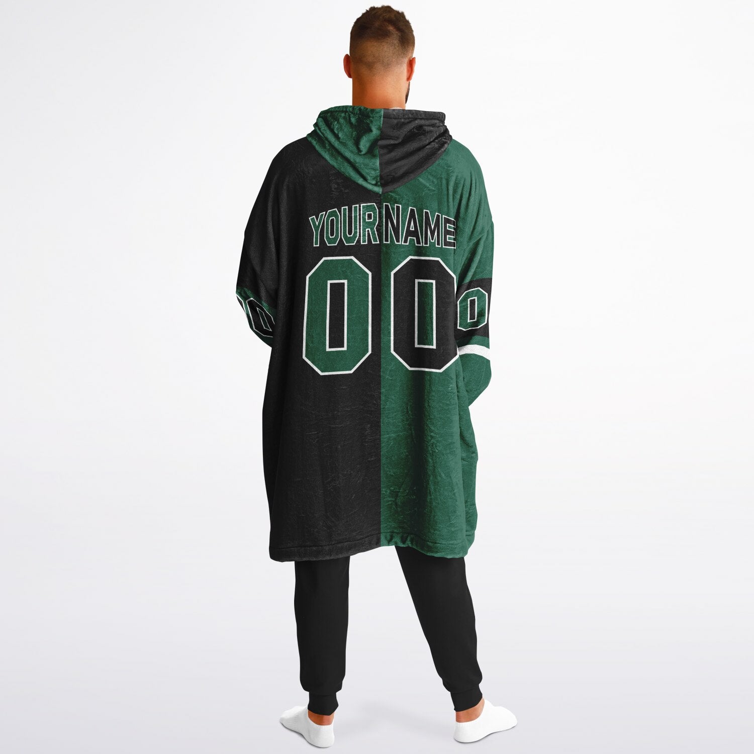 Green, black, and white halftime snug hoodie with three-tone split design and cozy fleece texture.