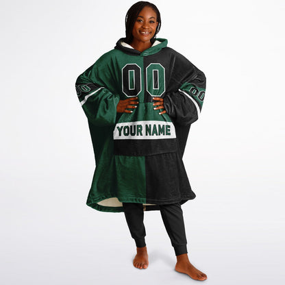 Green, black, and white halftime snug hoodie with three-tone split design and cozy fleece texture