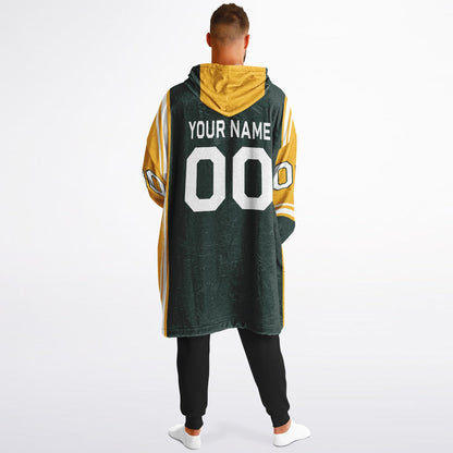 Green, gold, and white bold snug hoodie with triple color blocking and a sporty aesthetic.