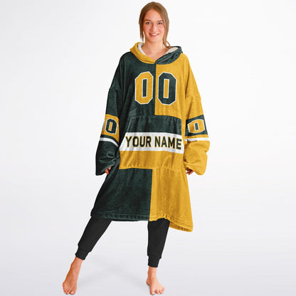 Green, gold, and white halftime snug hoodie with three-tone split design and cozy fleece texture.
