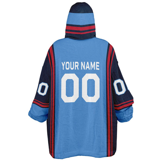 Light blue, navy, and red bold snug hoodie with triple color blocking and a sporty aesthetic.