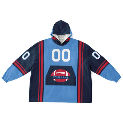 Light blue, navy, and red bold snug hoodie with triple color blocking and a sporty aesthetic.