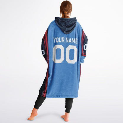 Light blue, navy, and red bold snug hoodie with triple color blocking and a sporty aesthetic.