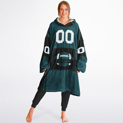 Midnight green and black bold snug hoodie with modern color-block design and soft loungewear fit.