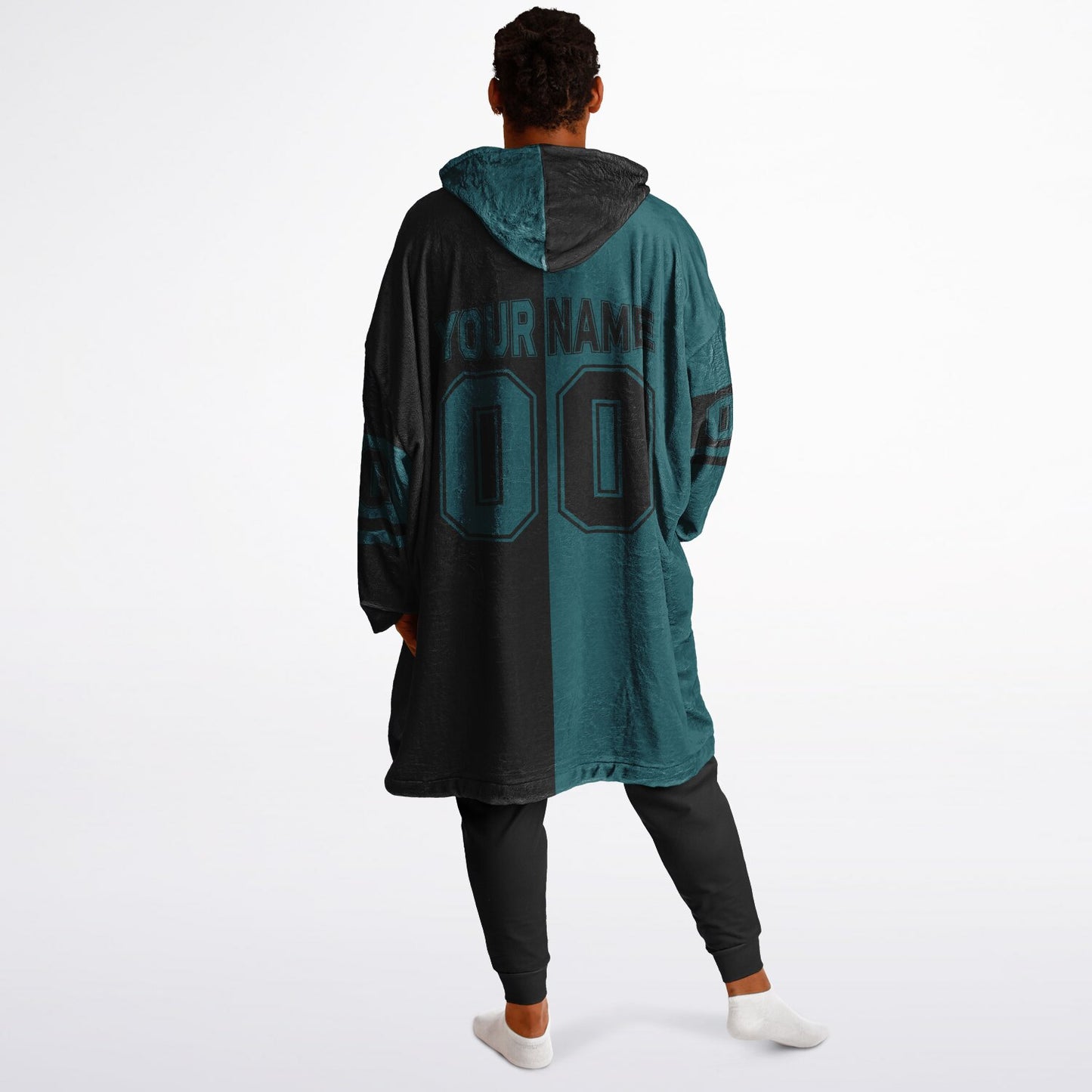 Midnight green and black halftime snug hoodie featuring a symmetrical split design for a dynamic game-day look.